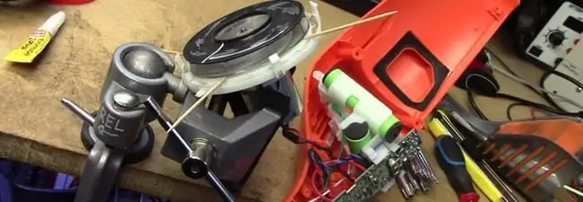 Vacuum cleaner repair parts and tools on a workbench in Chandler, AZ